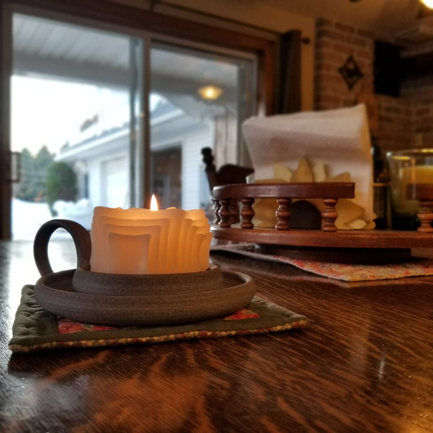 Side view of white squares on squares beeswax pillar candle