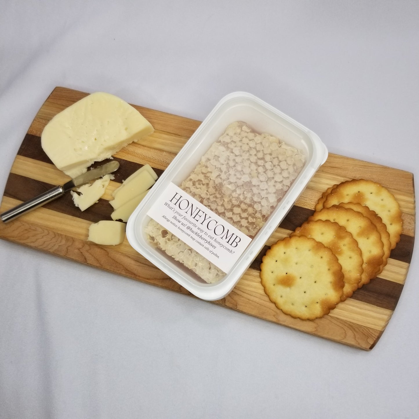 Honeycomb with cheese and crackers; raw honey, comb honey