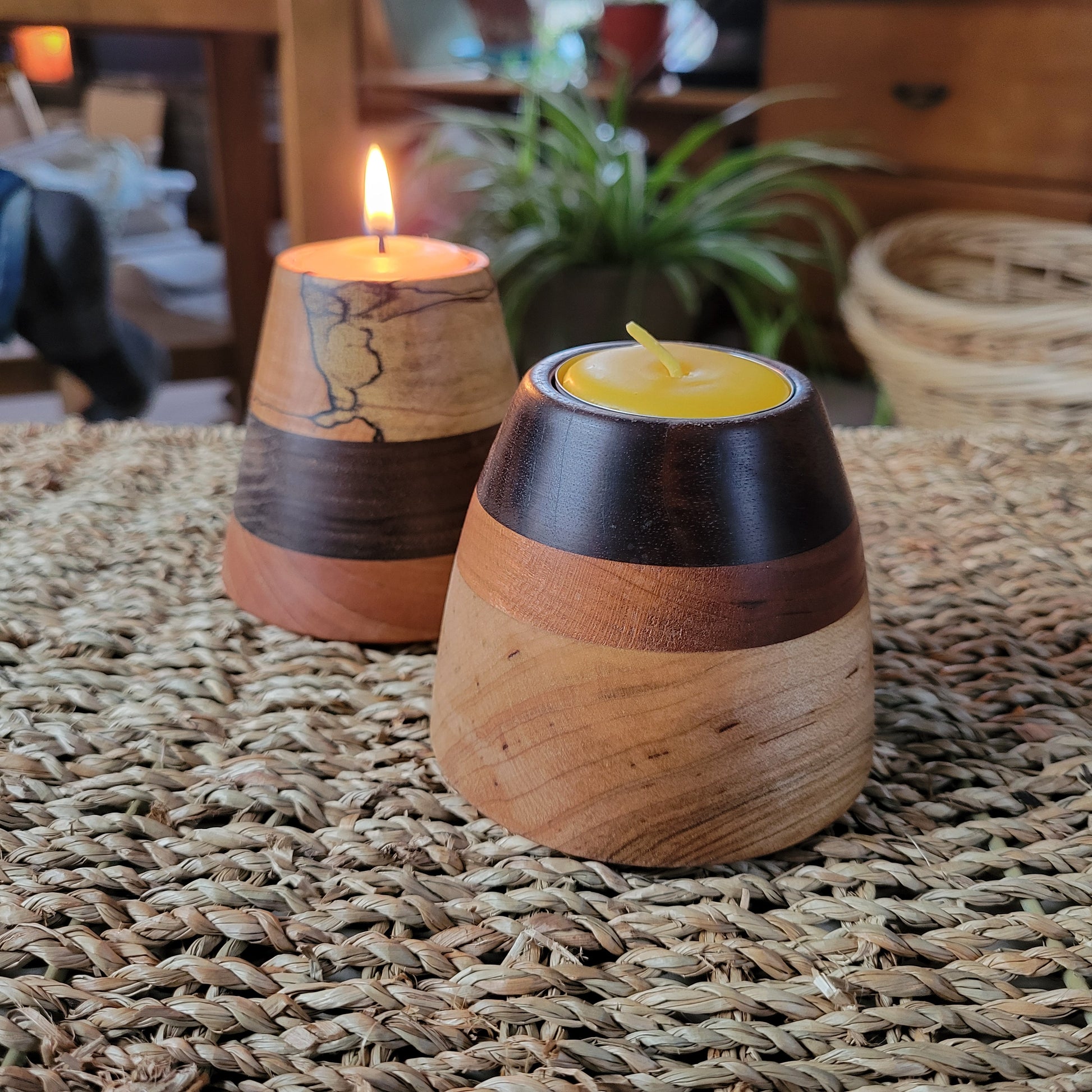 wooden tealight holder sits on a wicker table