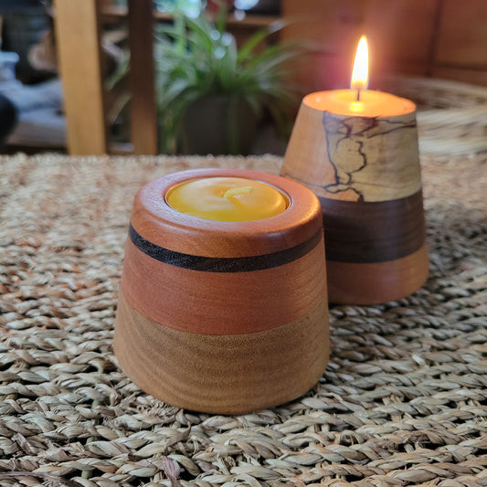 wooden tealight holder sits on wicker table