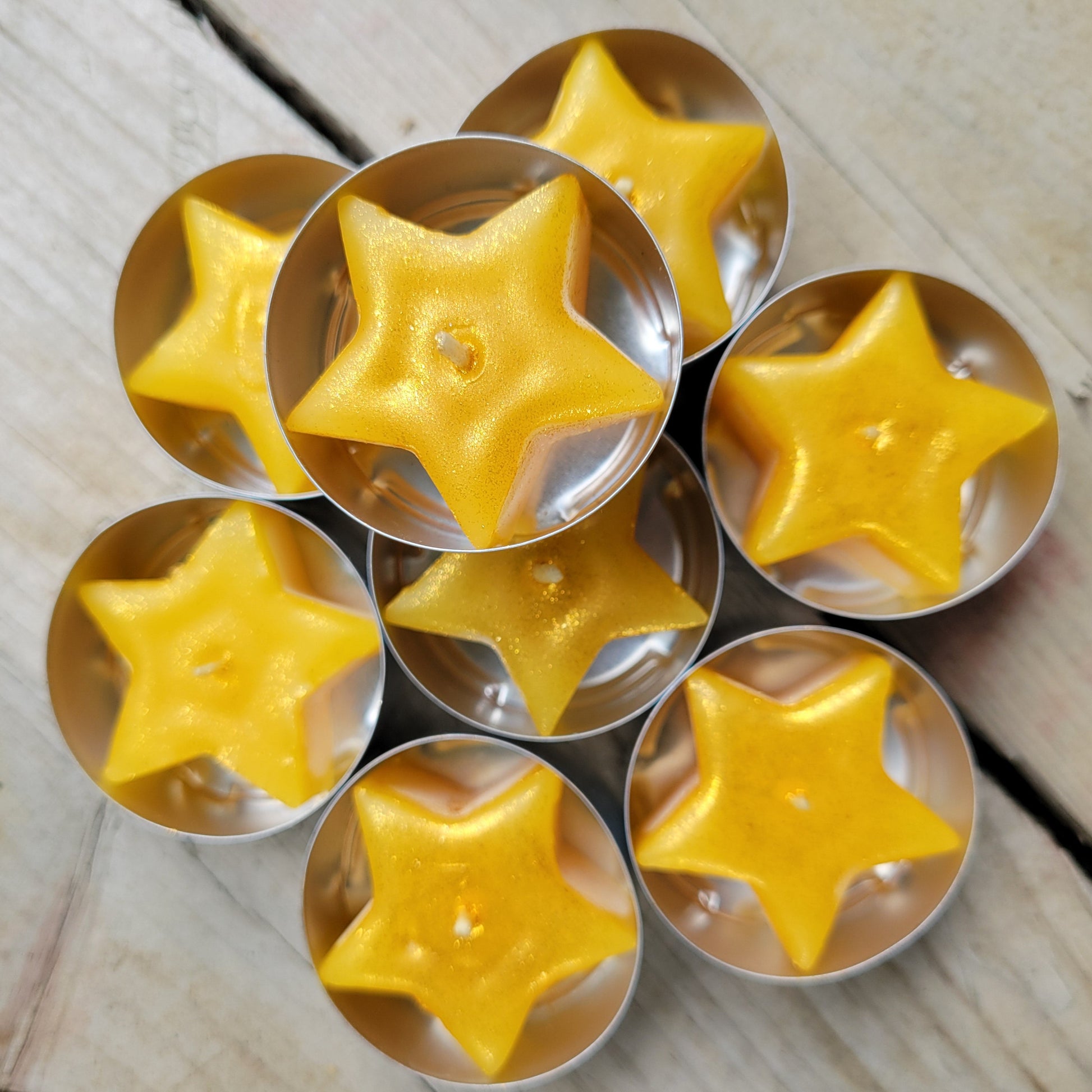 sparkly star beeswax candles in tealight tins