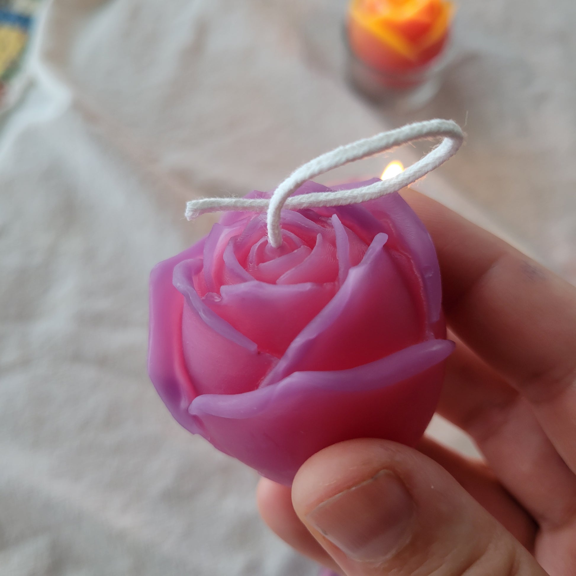 purple and pink rose shaped candle