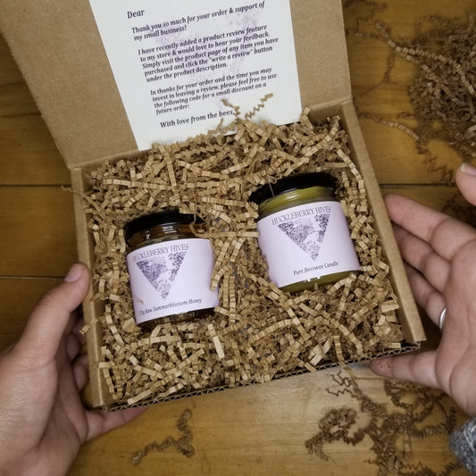 Gift box with honey and candle