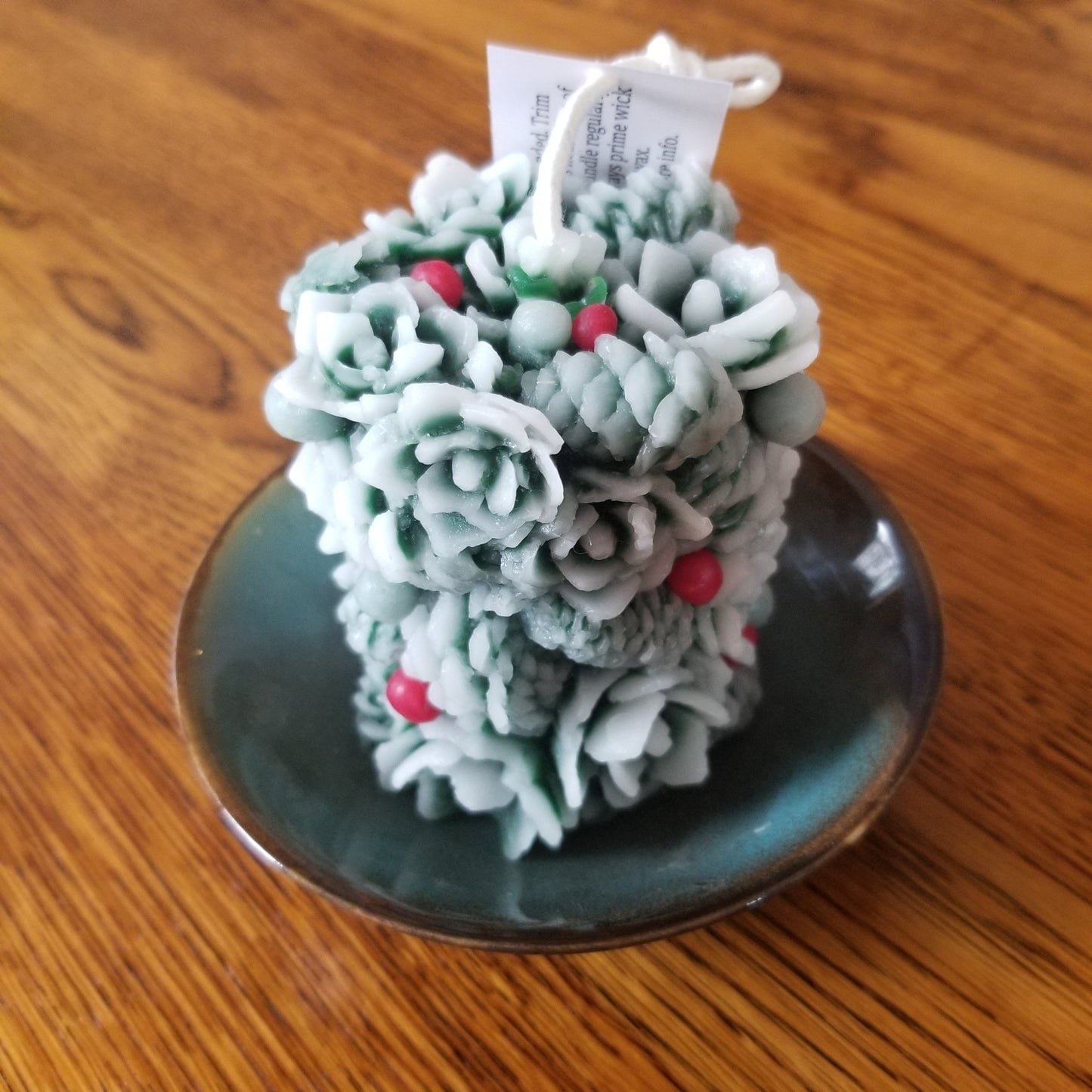 Greenery pillar; beeswax candle green with white frosting effect + red berries