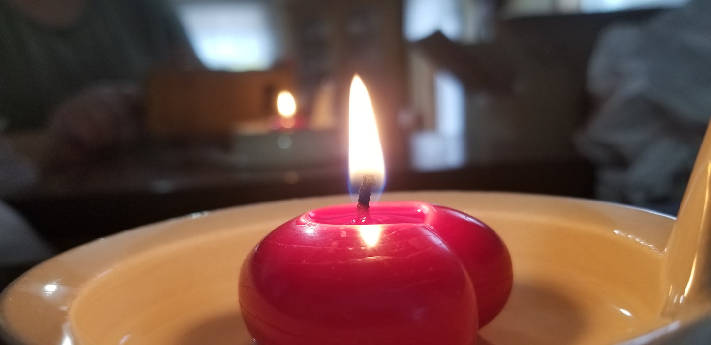 Red heart beeswax candle - lit/burning