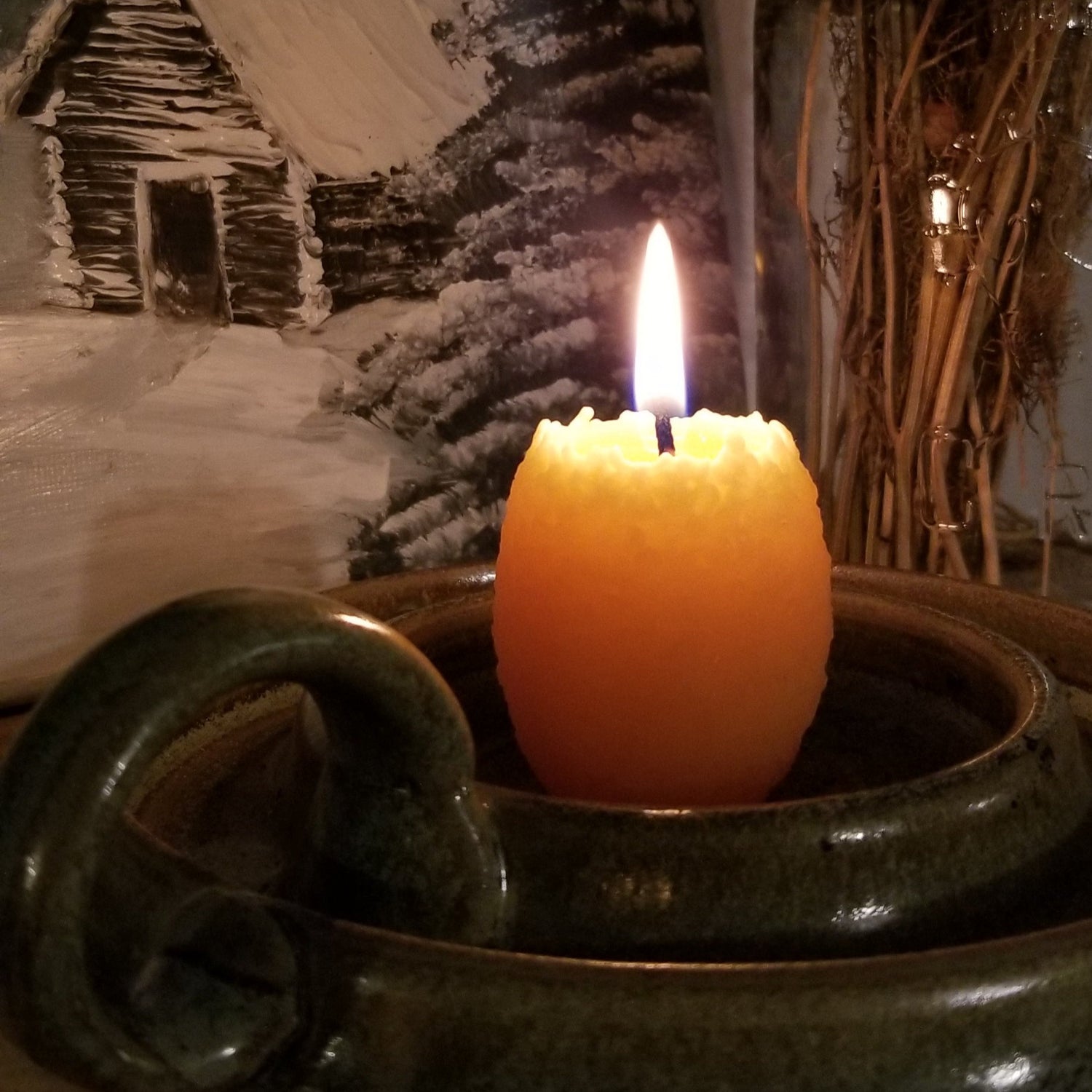 floral egg candle burning
